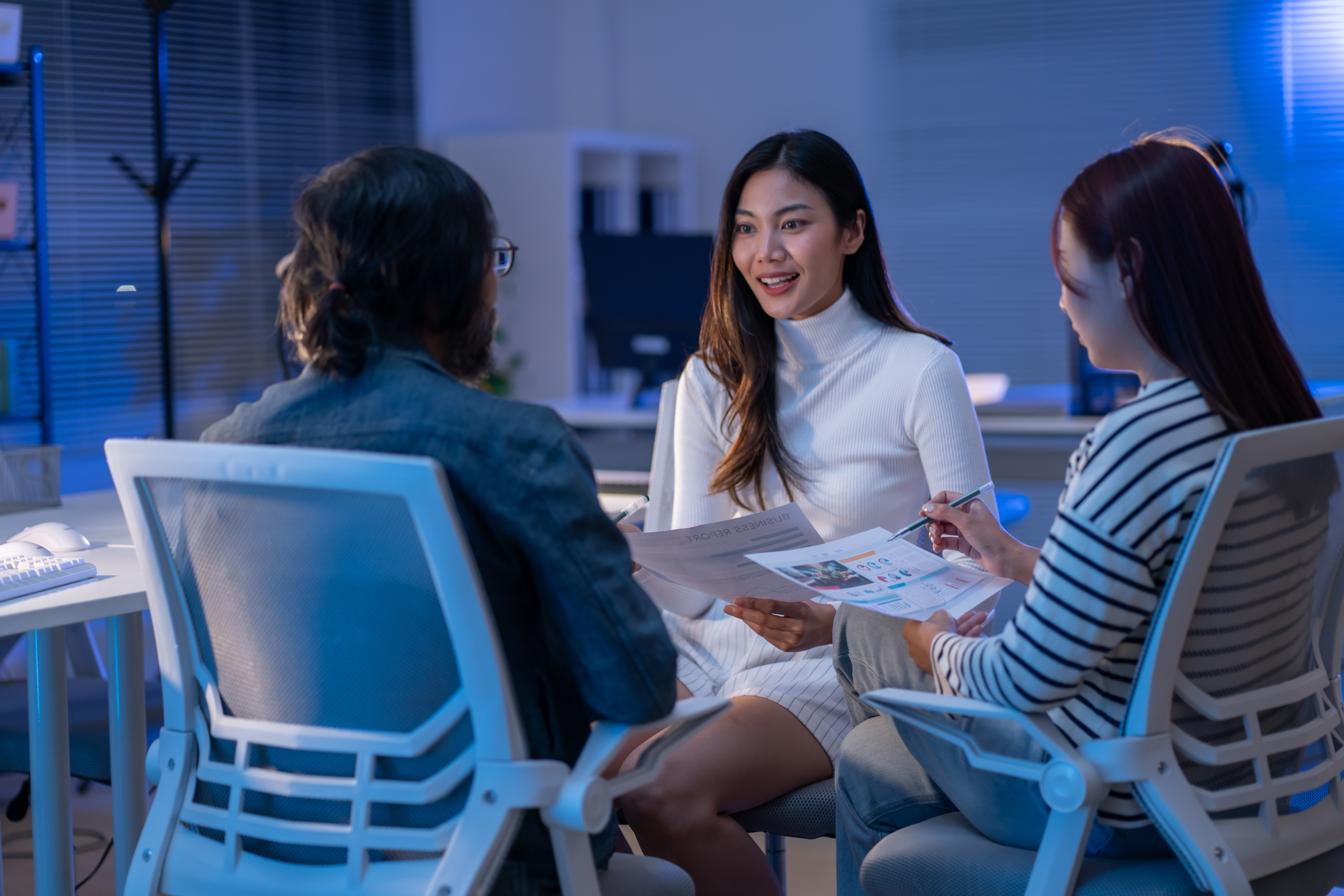 Team of experts discussing work around a table