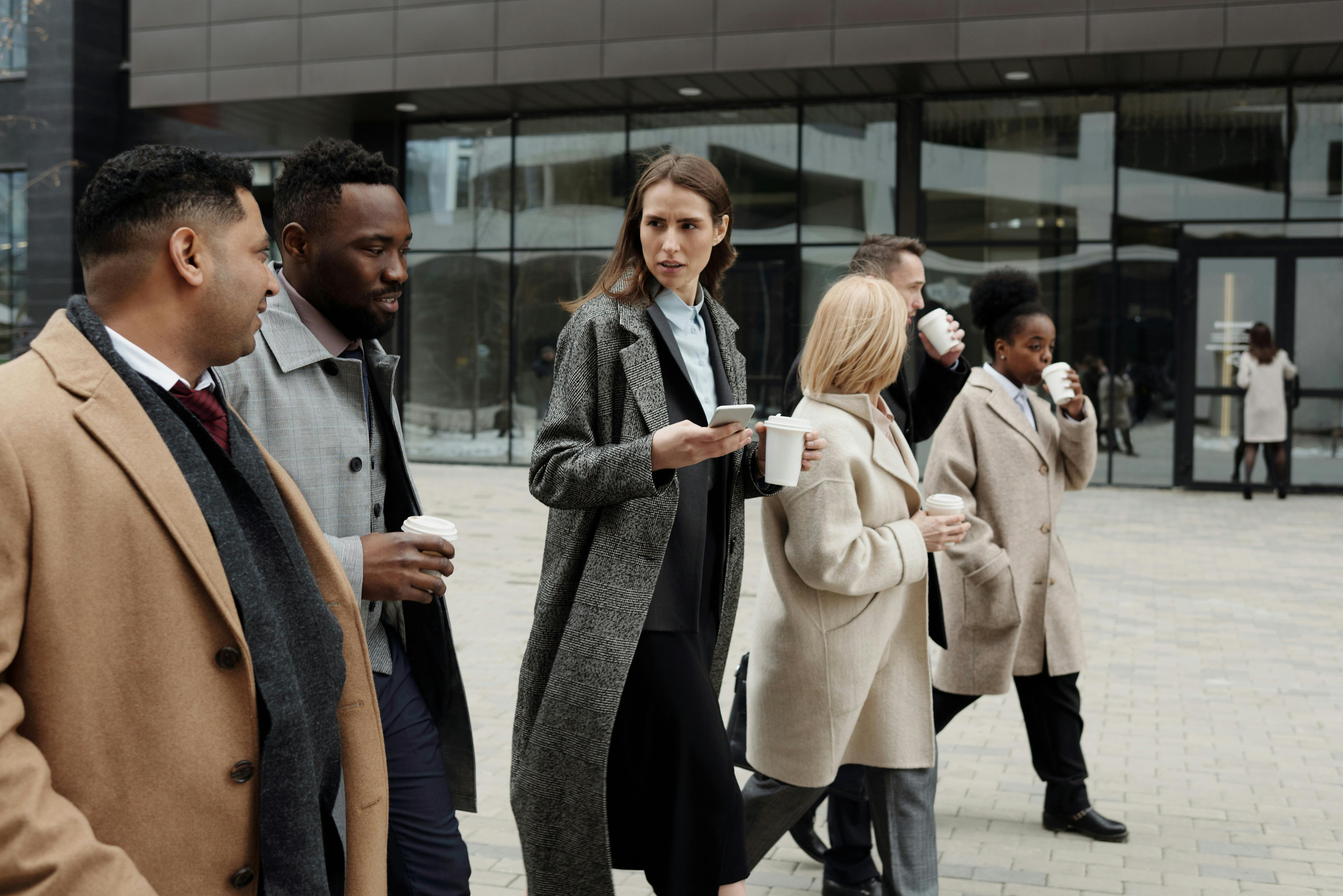 Business people walking in a modern hallway
